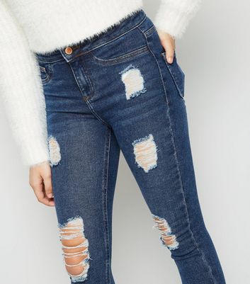 high waisted damaged jeans