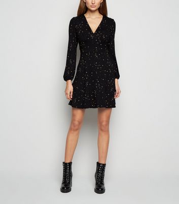 black long sleeve dress with stars