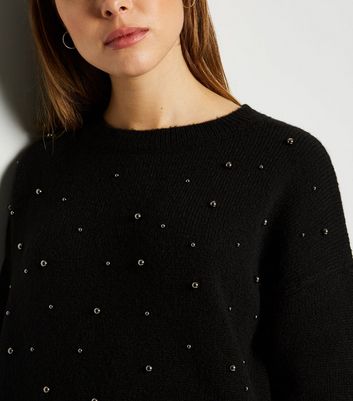 black jumper with pearls