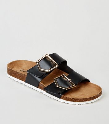 black buckle strap sandals