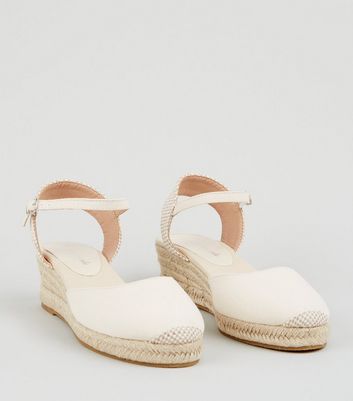 white canvas wedges