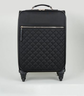 black quilted suitcase