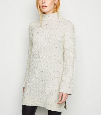 cream sweater dress with boots