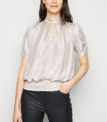 Metallic high outlet neck top