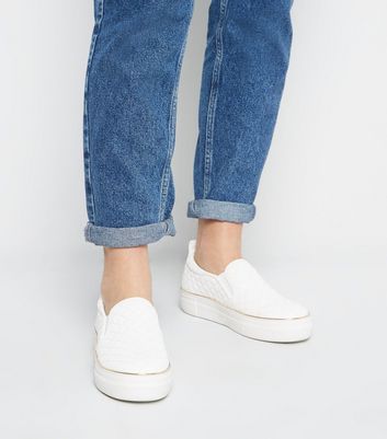 white quilted slip on shoes