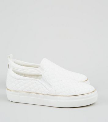 white quilted slip on shoes