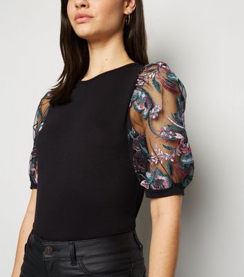 Black mesh top deals with embroidered flowers