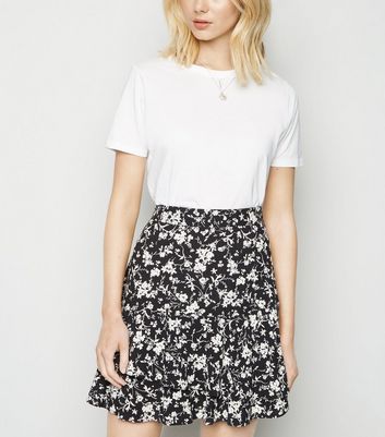 white ruffle black skirt