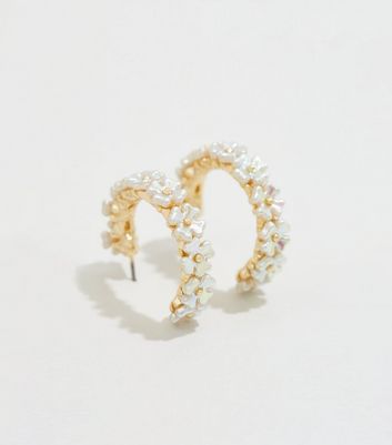 gold hoop earrings with flowers