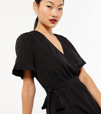 Click to view product details and reviews for Petite Black Frill Sleeve Mini Wrap Dress New Look.