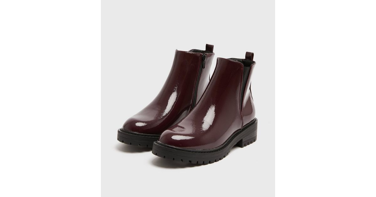 dark red patent chunky cleated chelsea boots