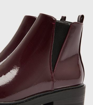 dark red patent chunky cleated chelsea boots