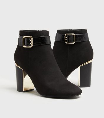 Black heeled 2024 buckle boots