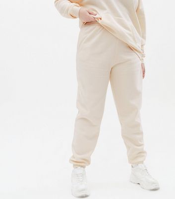 Click to view product details and reviews for Curves Cream Jersey Cuffed Joggers New Look.