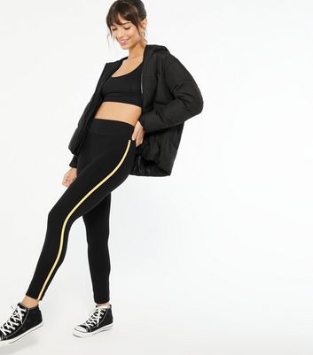 Black leggings with yellow 2024 stripe