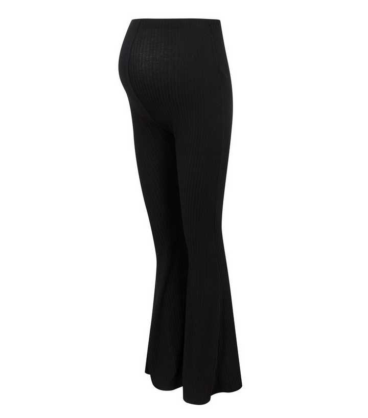 https://media3.newlookassets.com/i/newlook/672010501M9/womens/clothing/leggings/maternity-black-ribbed-flared-leggings.jpg?strip=true&qlt=50&w=720