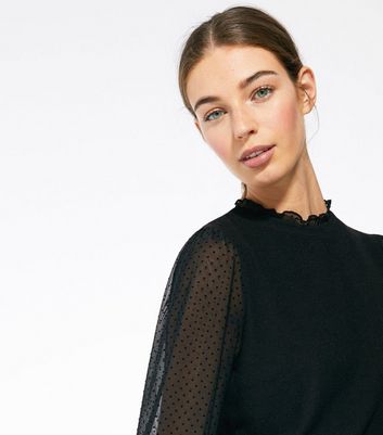 black jumper with see through sleeves