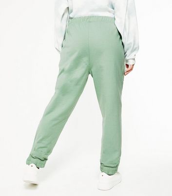 mint green jogging suit