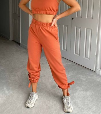 Orange on sale joggers womens