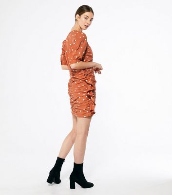 rust spotted dress