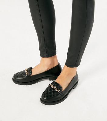 black quilted loafers