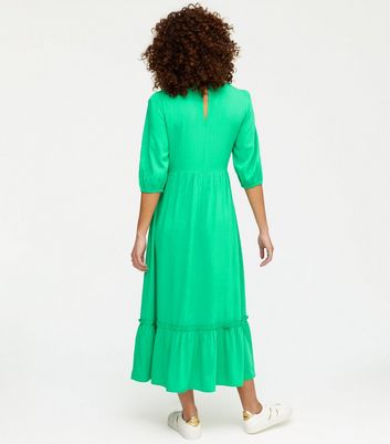 green shirred midi dress