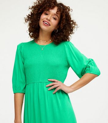 green shirred midi dress