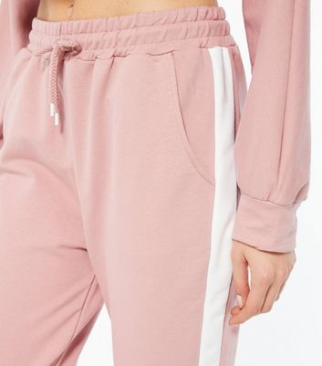 Pink joggers with online white stripe