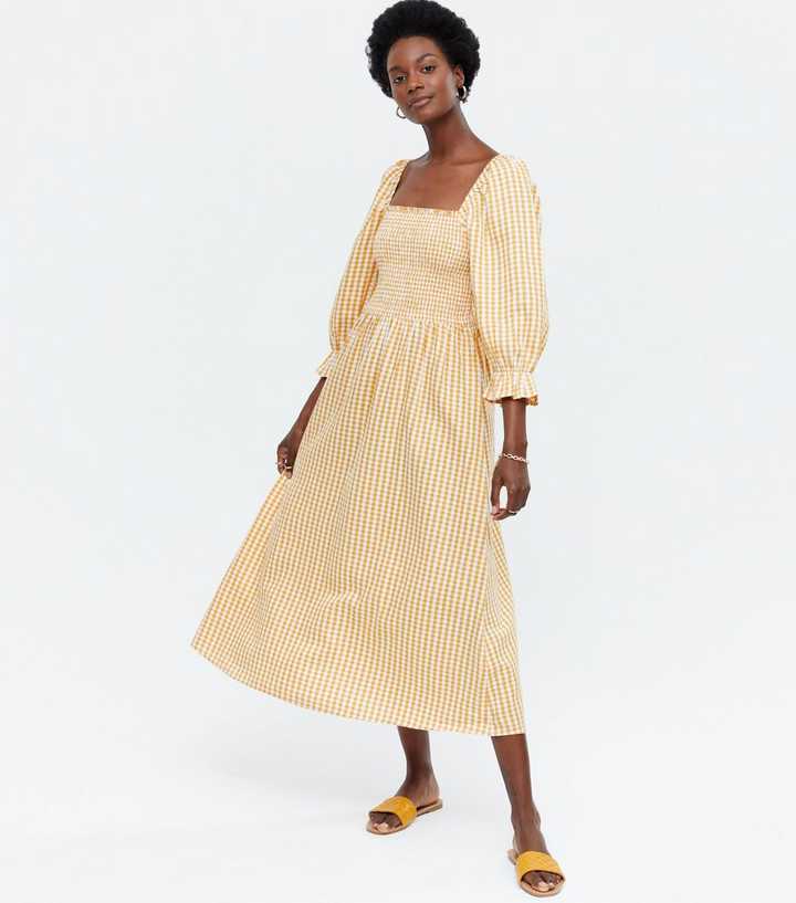 https://media3.newlookassets.com/i/newlook/681568289/womens/clothing/dresses/yellow-gingham-shirred-square-neck-midi-dress.jpg?strip=true&qlt=50&w=720