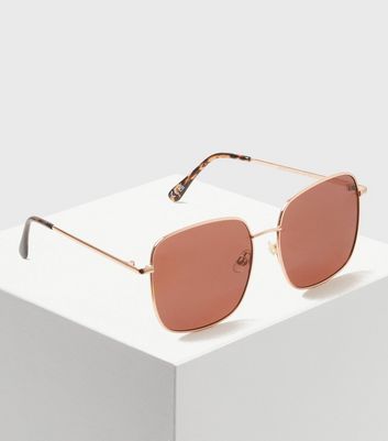 oversized gold sunglasses