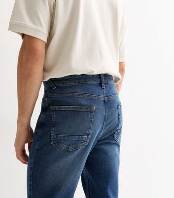 Mid wash blue jeans sales mens