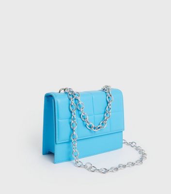 Pale blue handbags new on sale look