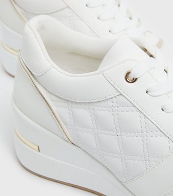 Click to view product details and reviews for White Quilted Metal Trim Wedge Trainers New Look Vegan.