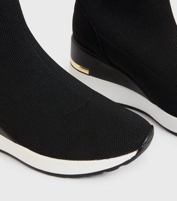 Click to view product details and reviews for Black Knit Metal Trim Wedge Trainers New Look Vegan.