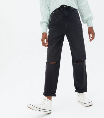 black mom jeans ripped knee