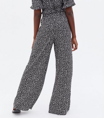 Click to view product details and reviews for Tall Black Ditsy Floral Wide Leg Trousers New Look.
