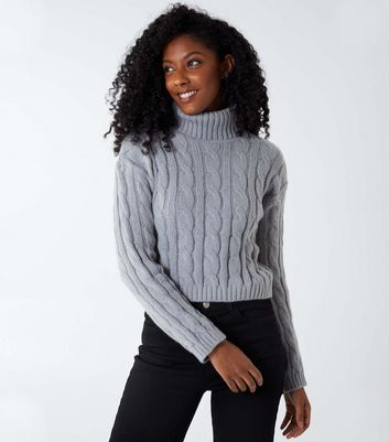 black cable knit roll neck jumper