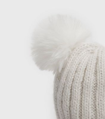 white knitted bobble hat