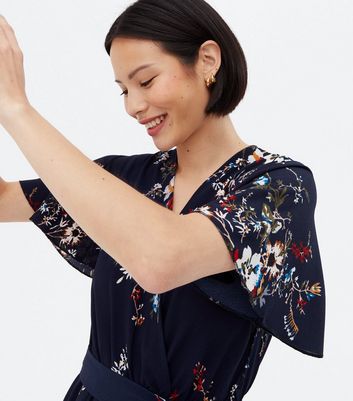 Click to view product details and reviews for Mela Navy Floral Dip Hem Midi Wrap Dress New Look.