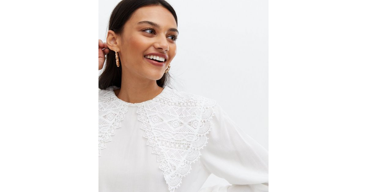 white blouse with lace sleeves