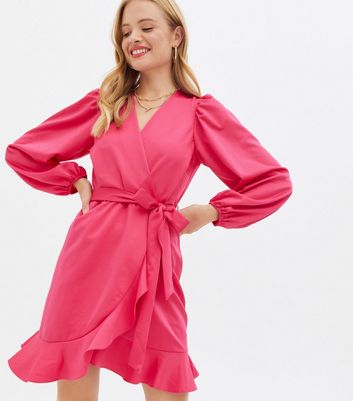 Click to view product details and reviews for Bright Pink Satin Ruffle Long Sleeve Mini Wrap Dress New Look.