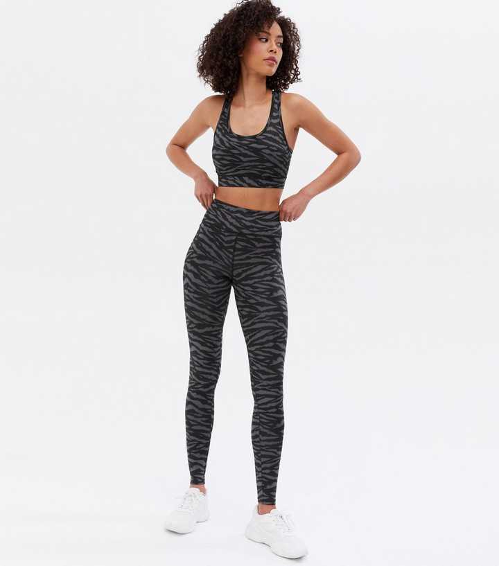 https://media3.newlookassets.com/i/newlook/810204209/womens/clothing/leggings/tall-black-zebra-print-high-waist-sports-leggings.jpg?strip=true&qlt=50&w=720