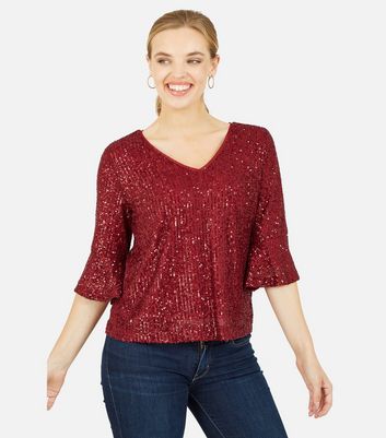 red sequin shirt