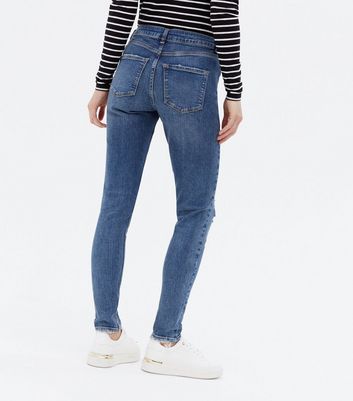 low rise destroyed skinny jeans