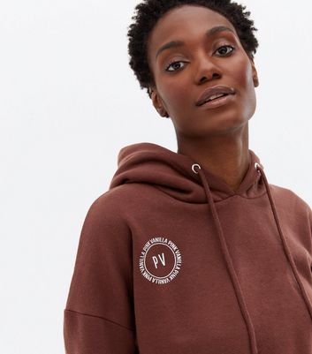 Click to view product details and reviews for Pink Vanilla Dark Brown Logo Crop Hoodie New Look.