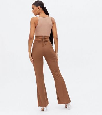 Click to view product details and reviews for Pink Vanilla Dark Brown Ribbed Cut Out Ring Flared Trousers New Look.