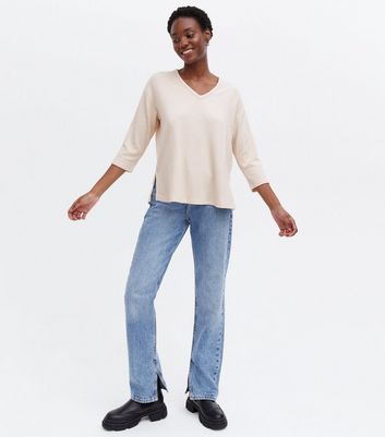 Click to view product details and reviews for Cream Brushed Fine Knit V Neck Split Hem Top New Look.