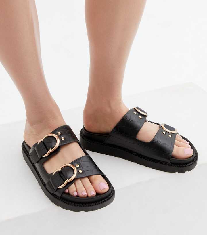 https://media3.newlookassets.com/i/newlook/814776501M1/womens/footwear/shoes/black-faux-croc-double-buckle-chunky-sliders.jpg?strip=true&qlt=50&w=720