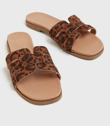 Click to view product details and reviews for Wide Fit Brown Leopard Print Suedette Footbed Sliders New Look Vegan.