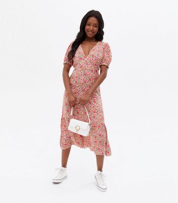 Click to view product details and reviews for Pink Ditsy Floral Tiered Midi Wrap Dress New Look.